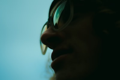 Close-up of blue-green background glasses
